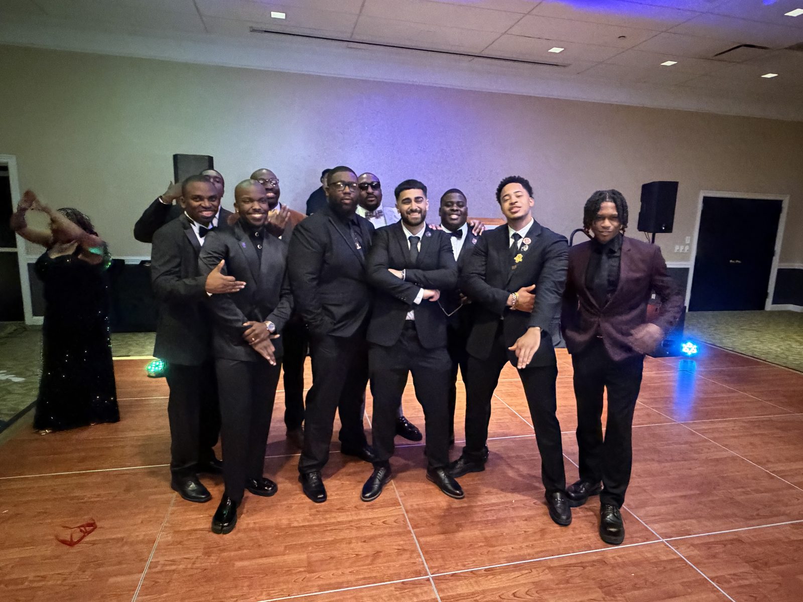 Young brothers in formal attire on the dance floor