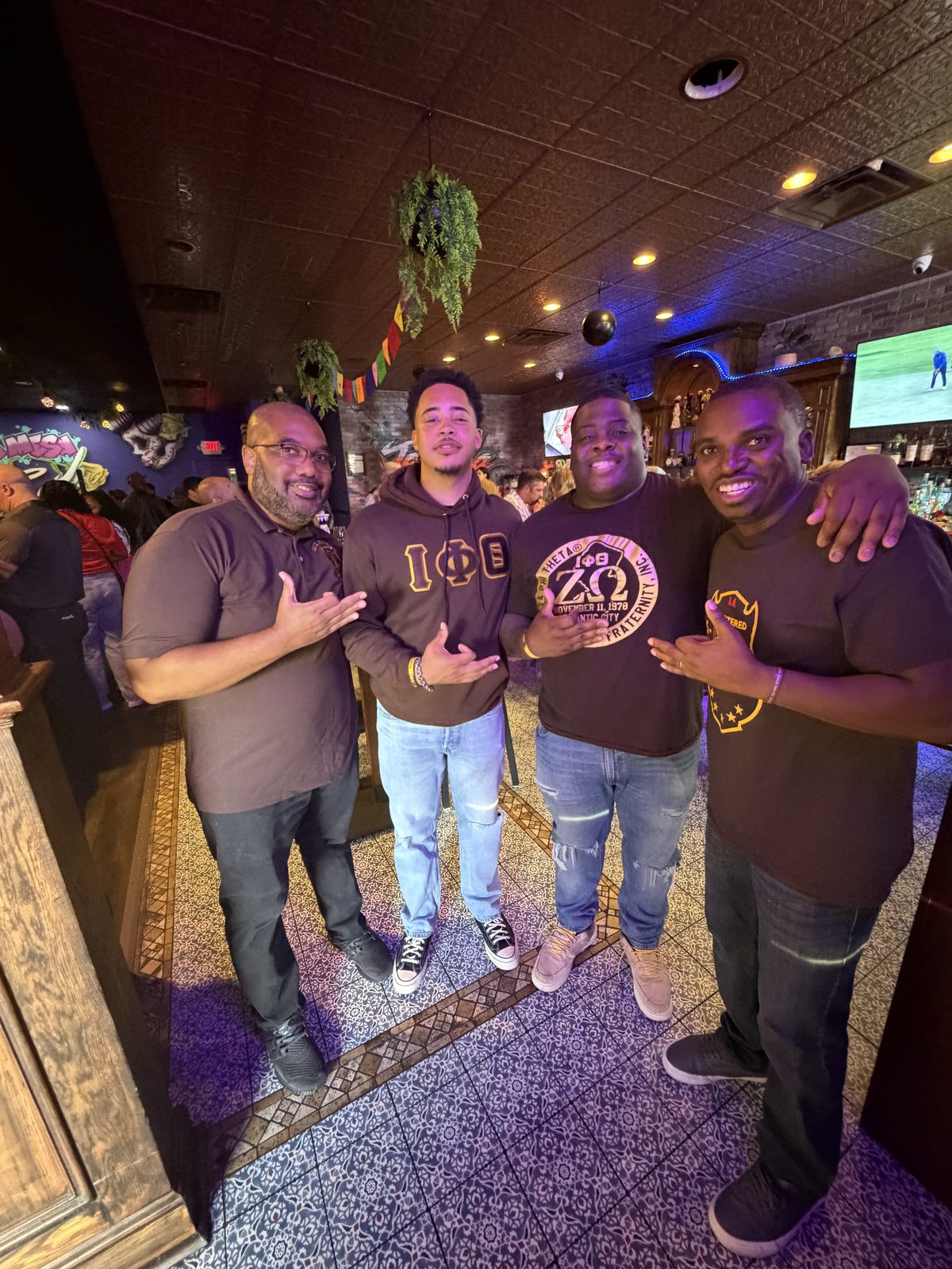 Brothers in chapter gear at a social gathering