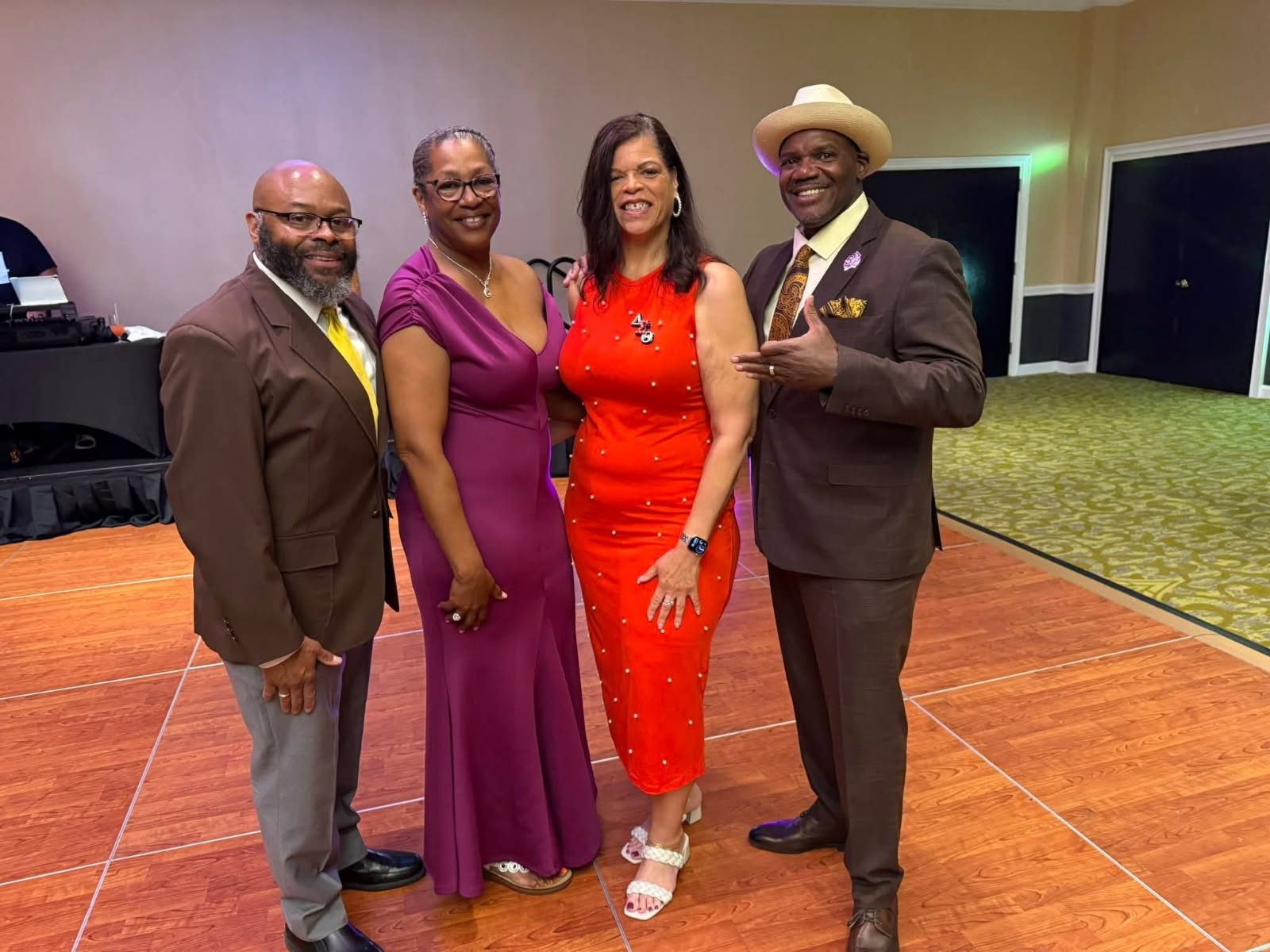 Couples dressed for a formal celebration