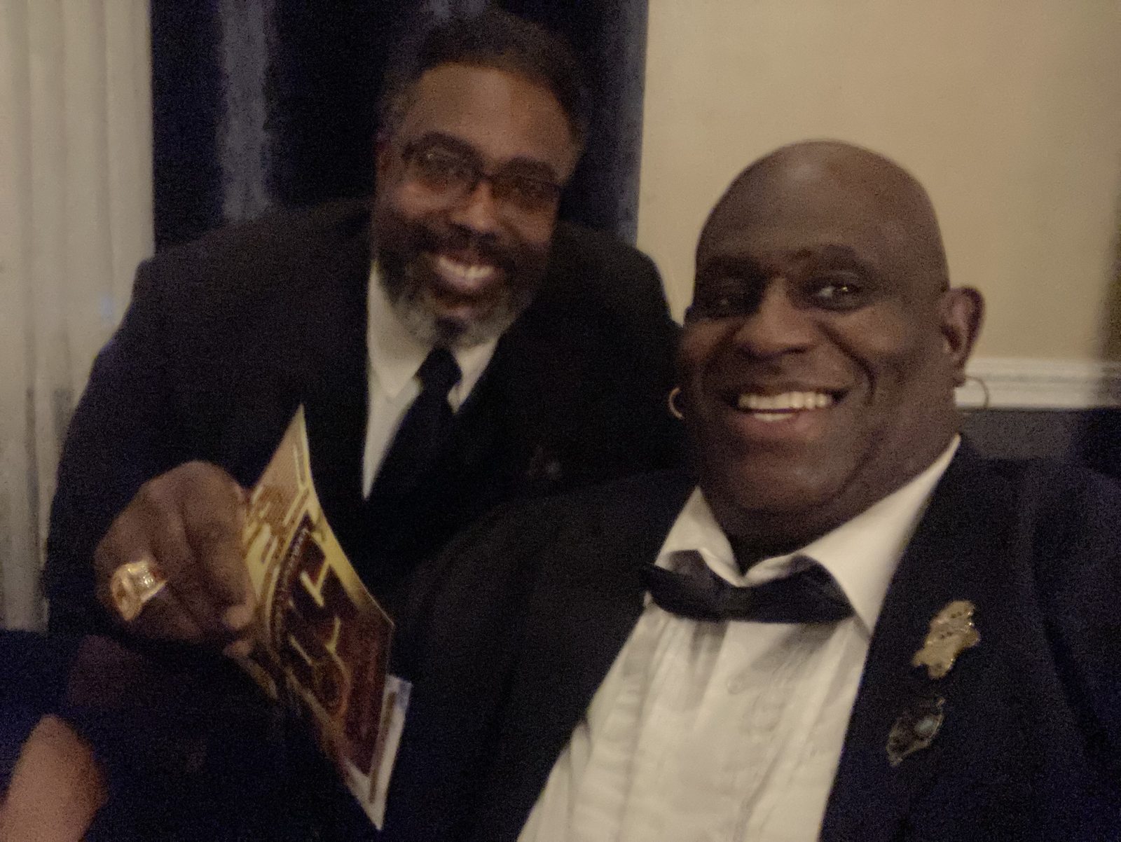 Two brothers sharing a moment at the gala